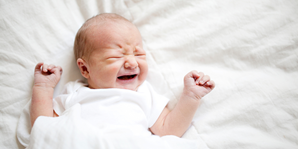 newborns cry when put down.